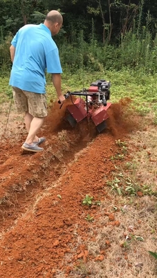 65 KG Compact 170F Μετακίνηση τεσσάρων τροχών Mini Power Tiller Cultivator για τη διαχείριση αγροκτημάτων